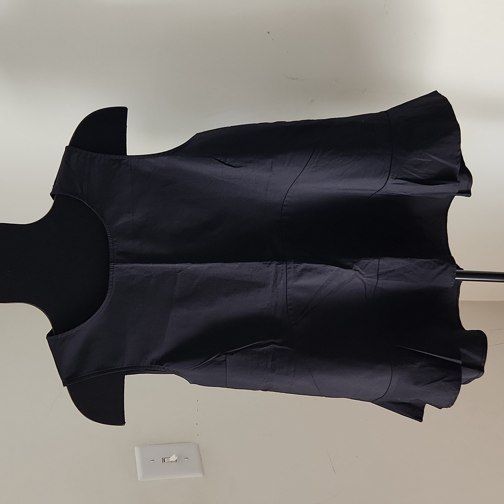 New York & Company black sleeveless peplum top, size M.